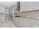 Modern kitchen featuring white cabinets and stainless steel appliances at 4881 Antrim Dr, Sarasota, FL 34240