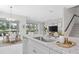 A modern kitchen leads to a dining area and living room at 4881 Antrim Dr, Sarasota, FL 34240