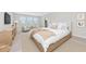 Serene main bedroom with large windows, a seating area, and plush bedding, creating a relaxing retreat at 4881 Antrim Dr, Sarasota, FL 34240