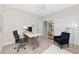 Well-lit office space with desk, chair, and a modern ceiling fan at 4881 Antrim Dr, Sarasota, FL 34240