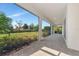 Spacious screened patio showcasing a beautiful landscaped backyard at 4881 Antrim Dr, Sarasota, FL 34240
