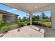 Covered patio with a view of the beautiful backyard at 4881 Antrim Dr, Sarasota, FL 34240
