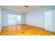 Inviting bedroom featuring hardwood floors, closet and a sunny window at 5053 Live Oak Cir, Bradenton, FL 34207
