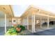 Charming carport welcomes you to this well-maintained condo with lush landscaping at 5053 Live Oak Cir, Bradenton, FL 34207