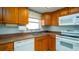 Well-lit kitchen featuring an efficient layout and essential appliances at 5053 Live Oak Cir, Bradenton, FL 34207