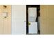 Convenient laundry area featuring a stacked washer and dryer at 5053 Live Oak Cir, Bradenton, FL 34207
