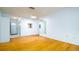 Bright living room featuring hardwood floors, a mirror accent, and an open layout at 5053 Live Oak Cir, Bradenton, FL 34207