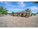 Large backyard featuring a screened-in pool and expansive gravel area at 5307 1St Avenue Nw Dr, Bradenton, FL 34209