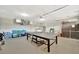 Spacious finished basement with ping pong table, laundry, and ample storage at 5307 1St Avenue Nw Dr, Bradenton, FL 34209