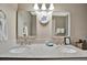 Bathroom features a double sink vanity with granite countertops, modern fixtures, and ample lighting at 5307 1St Avenue Nw Dr, Bradenton, FL 34209