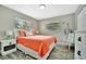 Bright bedroom featuring wood grain floors, a comfy bed, and ample natural light at 5307 1St Avenue Nw Dr, Bradenton, FL 34209