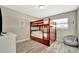 Bunk beds in cozy bedroom with wood grain flooring and natural light at 5307 1St Avenue Nw Dr, Bradenton, FL 34209