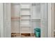 Walk-in closet with white shelving, providing ample storage space and organization at 5307 1St Avenue Nw Dr, Bradenton, FL 34209