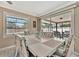 Bright dining room features a patio view through sliding glass doors and room for six at 5307 1St Avenue Nw Dr, Bradenton, FL 34209