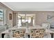 Bright dining room with stylish chairs, a modern table, and sliding glass doors leading to the outdoor patio at 5307 1St Avenue Nw Dr, Bradenton, FL 34209