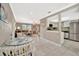 Bright living space showcasing neutral walls, tile floors, and updated kitchen with stainless steel appliances at 5307 1St Avenue Nw Dr, Bradenton, FL 34209