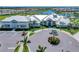 Aerial view of the recreation center featuring gray roof, manicured landscaping, and accessible parking at 5406 Coral Reef Way, Lakewood Ranch, FL 34211
