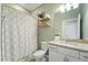 Bathroom featuring granite countertops, shelves, a sink, and a shower at 5406 Coral Reef Way, Lakewood Ranch, FL 34211