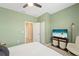 Bedroom featuring a television and doorway into another room at 5406 Coral Reef Way, Lakewood Ranch, FL 34211