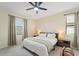 Bright bedroom features soft carpet, a ceiling fan, and a neutral color scheme at 5406 Coral Reef Way, Lakewood Ranch, FL 34211