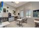 Cozy coffee bar area with beverage station, bar stool seating, and bright light from the large windows at 5406 Coral Reef Way, Lakewood Ranch, FL 34211