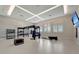 Gym featuring high ceilings, modern equipment, a television, and bright light from the windows at 5406 Coral Reef Way, Lakewood Ranch, FL 34211