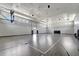 A spacious gymnasium with basketball hoops and a smooth court for sports and recreational activities at 5406 Coral Reef Way, Lakewood Ranch, FL 34211