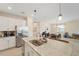 Open kitchen featuring stainless appliances, granite countertops and an eat-in dining space at 5406 Coral Reef Way, Lakewood Ranch, FL 34211