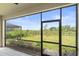 Relaxing screened lanai offering a view of the backyard and surrounding greenery for outdoor enjoyment at 5406 Coral Reef Way, Lakewood Ranch, FL 34211
