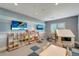 playroom featuring colorful decor, a TV, play structures, and toy storage for entertainment at 5406 Coral Reef Way, Lakewood Ranch, FL 34211