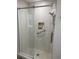 Modern bathroom featuring a glass-enclosed shower with tile surround and a convenient built-in shower niche at 5523 Scotia Pl, Sarasota, FL 34231