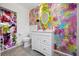 Colorful bathroom featuring a decorative mirror, vanity and a shower with a floral curtain at 5523 Scotia Pl, Sarasota, FL 34231