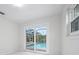 Bedroom with sliding glass doors that provide a great view of the screened in pool area at 5523 Scotia Pl, Sarasota, FL 34231