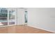 Bedroom showcasing wood floors and sliding glass door to the outdoor pool at 5523 Scotia Pl, Sarasota, FL 34231