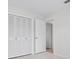 Spacious closet with louvered doors, located next to an open doorway at 5523 Scotia Pl, Sarasota, FL 34231