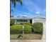 Charming single-story home with a manicured front yard, colorful landscaping, and a welcoming mailbox at 5523 Scotia Pl, Sarasota, FL 34231
