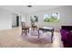 Bright living room featuring tile floors, large windows and unique furniture at 5523 Scotia Pl, Sarasota, FL 34231