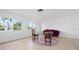 Bright living room featuring tile floors, large windows and unique furniture at 5523 Scotia Pl, Sarasota, FL 34231