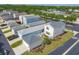 Aerial view of a single-Gathering home featuring a well-manicured lawn and attached garage at 5532 River Sound Ter, Bradenton, FL 34208