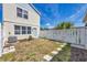 Fenced backyard featuring stepping stones and ample yard space at 5532 River Sound Ter, Bradenton, FL 34208