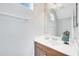 Bathroom showcasing wood vanity, clean white counter-top, and well lit with a large vanity mirror at 5532 River Sound Ter, Bradenton, FL 34208
