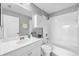 Bright bathroom featuring white cabinets, modern sink, and shower-tub combination at 5532 River Sound Ter, Bradenton, FL 34208