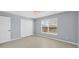 A neutral bedroom features tile floors, a closet, and lots of natural light at 5532 River Sound Ter, Bradenton, FL 34208