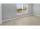 An empty bedroom with tile floors, neutral walls, and a large window at 5532 River Sound Ter, Bradenton, FL 34208