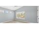 Bright bedroom with neutral paint, tile flooring and a large window at 5532 River Sound Ter, Bradenton, FL 34208