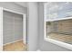 A white closet with metal shelves and a window at 5532 River Sound Ter, Bradenton, FL 34208