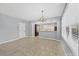 Bright dining area with modern chandelier and open to kitchen at 5532 River Sound Ter, Bradenton, FL 34208