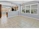 Open concept dining area with kitchen view and natural light at 5532 River Sound Ter, Bradenton, FL 34208