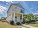 Charming two-story home with a welcoming front porch, lush landscaping, and a well-maintained lawn at 5532 River Sound Ter, Bradenton, FL 34208