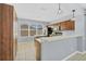 Kitchen boasts stainless steel appliances and dark wood cabinetry at 5532 River Sound Ter, Bradenton, FL 34208